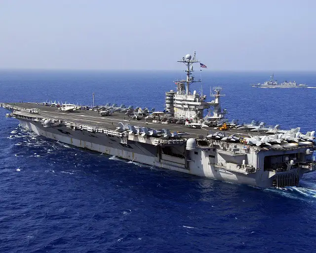 A US aircraft carrier entered a zone near the Strait of Hormuz being used by the Iranian navy for wargames, an Iranian official said Thursday amid rising tensions over the key oil-transit channel. "A US aircraft carrier was spotted inside the manoeuvre zone... by a navy reconnaissance aircraft," Commodore Mahmoud Mousavi, the spokesman for the Iranian exercises, told the official IRNA news agency.