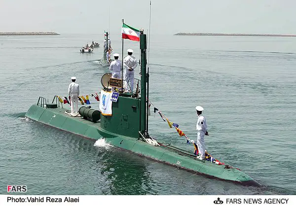 Iran launched a semi-heavy submarine in a bid to boost its naval capabilities in the high seas, Iranian Defense Minister Brigadier General Hossein Dehqan announced. Iran launched the largest submarine it has ever built into the Gulf & is building a second according to satellite. This is the first time that the Fateh-class submarines that Iran has said it is building have been seen. The first submarine can be seen in the water at the Bostanu shipyard on the Strait of Hormuz in satellite imagery. A second submarine can be seen under construction at the Bandar Anzali Naval Base on the Caspian Sea in Iran in September. 