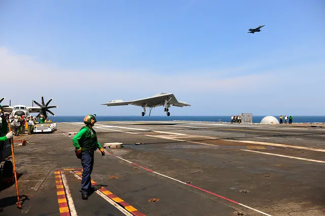 USS GEORGE H. W. BUSH, at sea (NNS) -- The X-47B Unmanned Combat Air System (UCAS) demonstrator completed its first-ever carrier-based arrested landing on board USS George H.W. Bush (CVN 77) off the coast of Virginia July 10. 