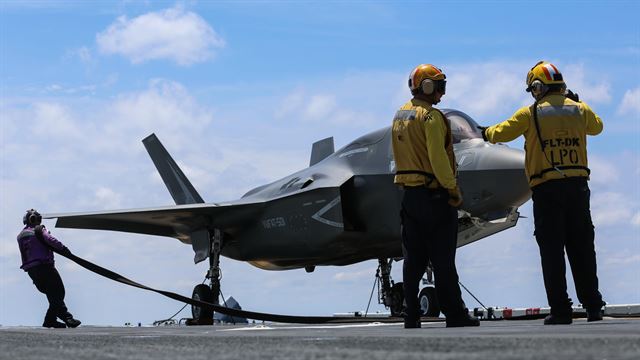 Maintenance is performed on an F-35B Lightning II on the flight deck of USS Wasp (LHD-1) during routine daylight operations, a part of Operational Testing 1, May 22. OT-1 is serving the purpose of evaluating the full spectrum of F-35B measures of suitability and effectiveness, as well as assessing the integration of the aircraft into the spectrum of flight operations. The F-35B is with Marine Fighter Attack Training Squadron 501, Marine Aircraft Group 31, 2nd Marine Aircraft Wing. 