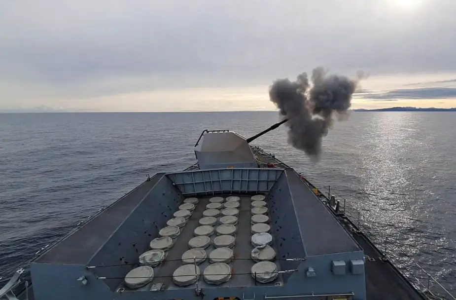 British Navys HMS Sutherland shows her flare during night shoot 925 001