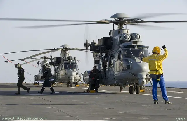 French Air Force Eurocopter Caracal (EC775) Combat Seach and Rescue (CSAR) helicopters getting ready on French Navy's Mistral BPC deck. 