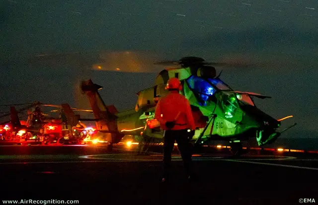 French Army Eurocopter Tigre and Gazelle helicopters getting ready on French Navy's Mistral BPC deck for a night mission over libyan territory.