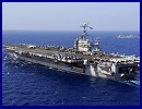 A US aircraft carrier entered a zone near the Strait of Hormuz being used by the Iranian navy for wargames, an Iranian official said Thursday amid rising tensions over the key oil-transit channel. "A US aircraft carrier was spotted inside the manoeuvre zone... by a navy reconnaissance aircraft," Commodore Mahmoud Mousavi, the spokesman for the Iranian exercises, told the official IRNA news agency.