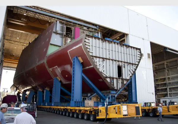 On Thursday, November 17, General Dynamics Bath Iron Works celebrated the keel laying of Zumwalt (DDG 1000), the first ship in the planned three-ship Zumwalt class of guided-missile destroyers. The keel unit is the 4,000-ton, heavily outfitted mid-forebody section of the ship, which was moved from the shipyard’s Ultra Hall construction facility onto the building ways in late October.