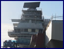 The crew of HMS Queen Elizabeth flashed up the new carrier's 'invisible eyes' as part of ongoing preparations to ready the leviathan for sea next year. The S1850M radar – the same as those fitted to Type 45 and Horizon destroyers – is a large black slab (over eight tonnes, 32 square metres) sitting on top of the carrier’s forward island.