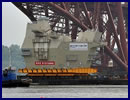 THE HUGE aft island of HMS Queen Elizabeth passed under the Forth Bridge today (Friday June 21) as it made its way to Rosyth, where the ship is being assembled. The iconic section, known as Upper Block 14, was constructed in 90 weeks by Aircraft Carrier Alliance workers at BAE Systems in Scotstoun. The aft island houses HMS Queen Elizabeth’s air traffic control systems and will be the centre of all on-board flight operations.