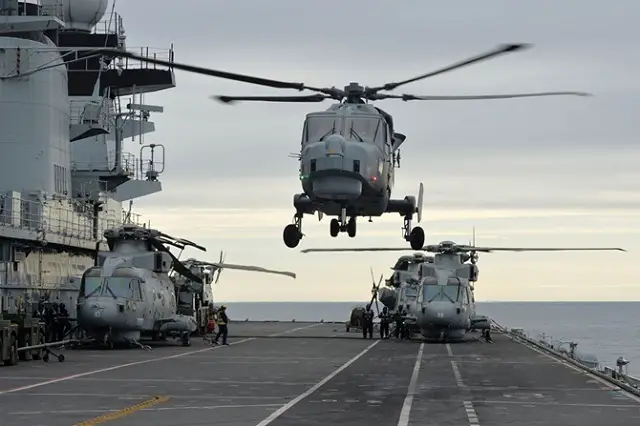 The Royal Navy’s new helicopter has paid its first visit to HMS Illustrious – dropping in on the veteran carrier during a submarine hunting exercise off Cornwall. Wildcat, which will replace the long-serving Lynx on the front line from next year, touched down on Lusty in the middle of Exercise Deep Blue.