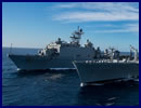 Amphibious assault ship USS Boxer (LHD 4) transferred fuel to dock landing ship USS Harpers Ferry (LSD 49) during an underway replenishment, Dec. 10. This event was unique in that Boxer is the only ship in the Boxer Amphibious Ready Group (ARG) with the capability to provide fuel as well as receive it.