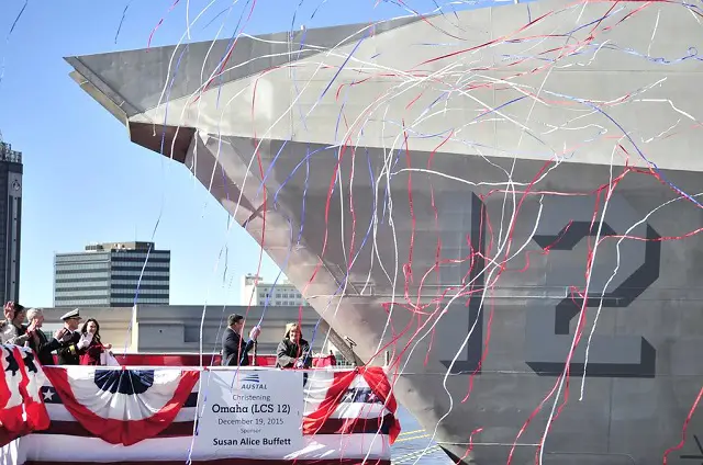 MOBILE, Ala. (Dec. 19, 2015) Susan A. Buffett, ship's sponsor for the littoral combat ship Pre-Commissioning Unit, Omaha (LCS 12), breaks a bottle across the ship's bow during a christening ceremony at Austal USA shipyard in Mobile, Ala. (U.S. Navy photo by Mass Communication Specialist 1st Class Michael C. Barton/Released)