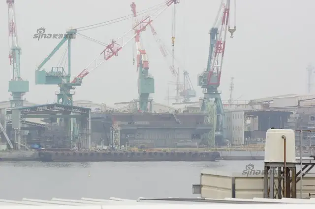 Recent pictures have emmerged showing the construction work in progress on Japan Maritime Self Defense Force (JMSDF) second Izumo-class helicopter carrier. The island has been placed on the hull of the destroyer in the dry construction dock at the Ishikawajima-Harima Heavy Industries Co., Ltd (IHI Corporation) in Yokohama. The DDH-184 which has yet to be nammed should be launched in August this year.