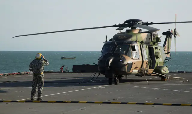 A Royal Australian Navy MRH90 helicopter conducts pre-flight checks before departing HMAS Choules during Exercise Talisman Sabre 2015.