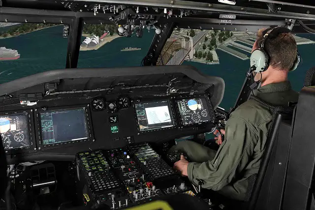 A military representative “flies” the MH-60R Seahawk tactical operational flight trainer over Sydney, Australia, during a recent simulation event. In February, the Royal Australian Navy procured a trainer, similar to the one in this photo, to support training capabilities for its new MH-60R Seahawk fleet. (Photo courtesy CAE)