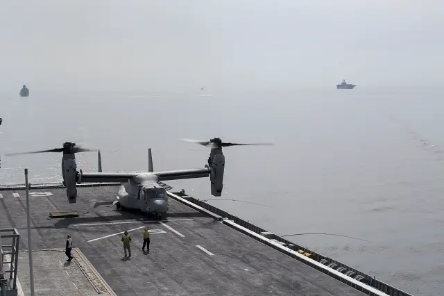 A U.S. Marine Corps MV-22B Osprey tiltrotor aircraft made its first ever landing on the flight deck of a Republic of Korea Navy amphibious assault ship off the coast of the Korean peninsula, March 26, 2015. The Osprey departed from the USS Bonhomme Richard (LHD 6) nearby and landed on the ROK ship Dokdo (LPH-6111).