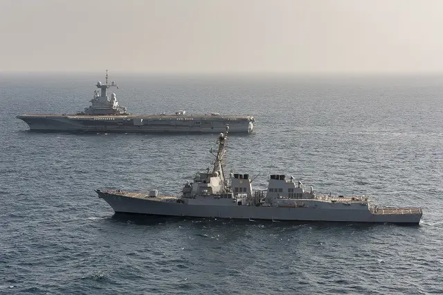 The guided-missile destroyer USS Bulkeley (DDG 84), front, sails alongside the French aircraft carrier Charles de Gaulle (R 91). (French navy photo by Chief Petty Officer Francois Marcel/Released)