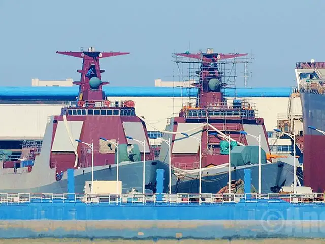 September 2015 picture showing two Type 052D Destroyer hulls in various stages of completion at the Changxing Jiangnan naval shipyard near Shanghai.