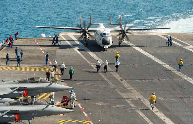 The C-2A Greyhound carrier maneuvers at the stern of aircraft carrier Charles de Gaulle