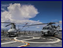 The "Wildcards" of U.S. Navy Helicopter Sea Combat Squadron (HSC) 23 made history Sept. 14 when they used a MQ-8B unmanned air system as a laser designator platform for a MH-60S Seahawk helicopter to fire a AGM-114N Hellfire missile.