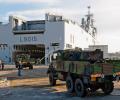 Support vehicles (Renault GBC-180) are loaded onboard the Amphibious Assault Ship, Force Projection & Command Vessel.